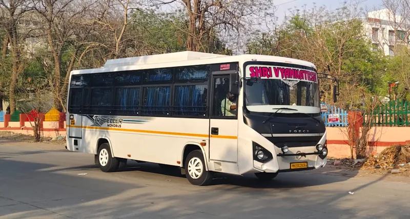35 seater Force Traveller Monobus exterior, front three-quarter view, Shri Vyankatesh Tours and Travels