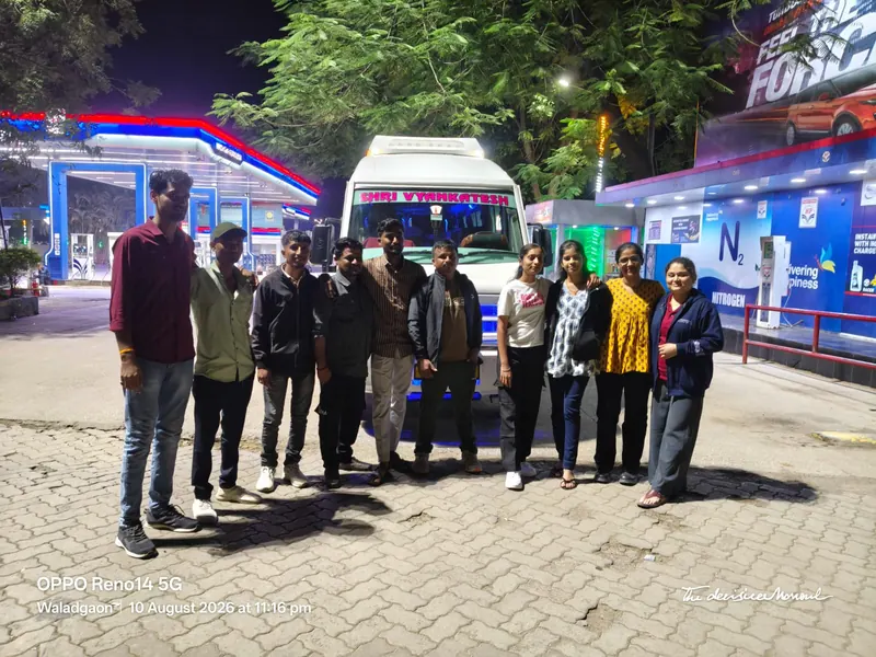 Customer group with bus at night, Shri Vyankatesh Tours and Travels